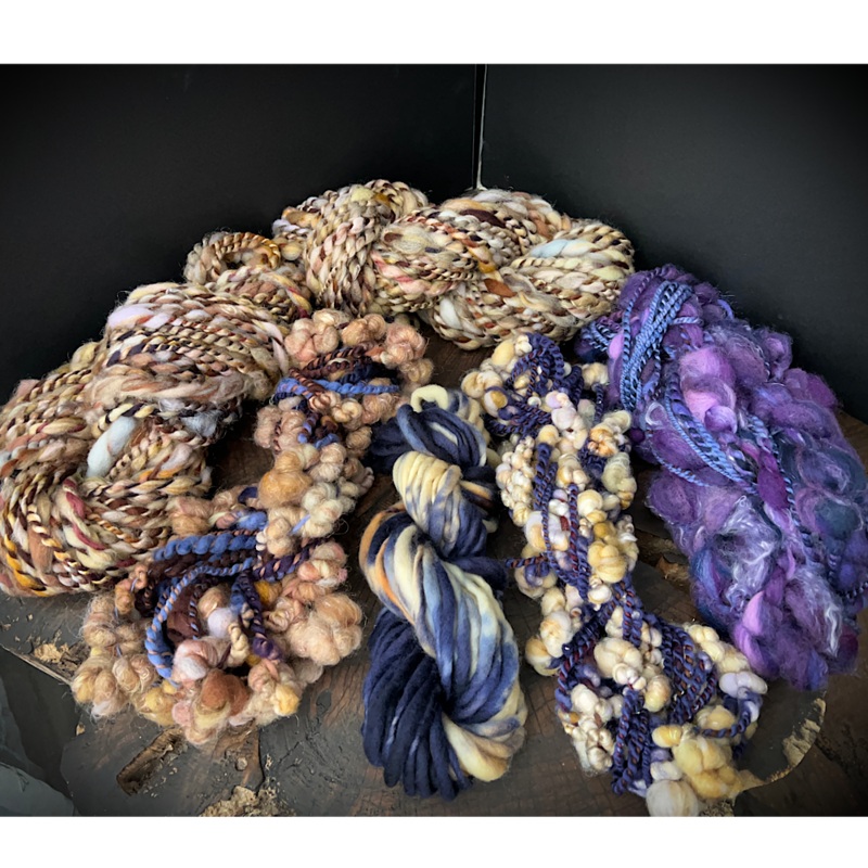 Large assortment of art yarns for weavers and knitters